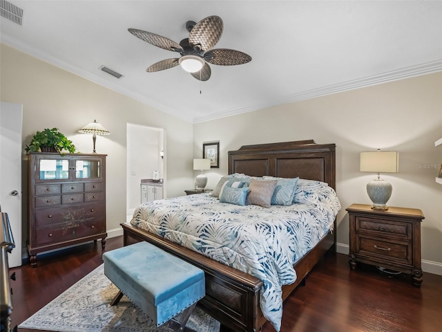 17324 SE 82nd Pecan Ter, The Villages, FL 32162 - bedroom featuring crown molding, wood finished floors, baseboards, ensuite bathroom, and a ceiling fan