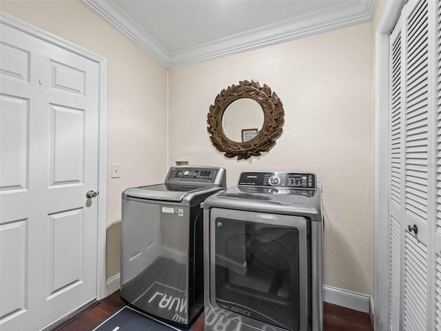 17324 SE 82nd Pecan Ter, The Villages, FL 32162 - laundry area with washing machine and clothes dryer, crown molding, dark wood-style flooring, and baseboards