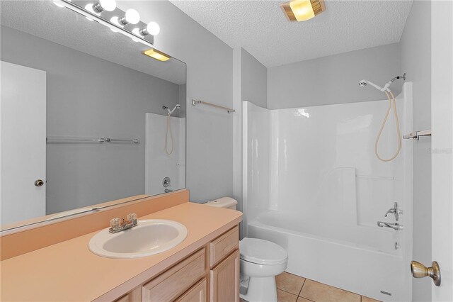 1116 San Bernardo Rd, The Villages, FL 32162 - full bathroom with toilet, shower / bathtub combination, tile patterned floors, vanity, and a textured ceiling