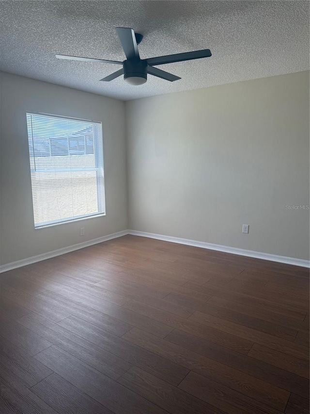 1116 San Bernardo Rd, The Villages, FL 32162 - unfurnished room with dark wood-style floors, a textured ceiling, baseboards, and ceiling fan