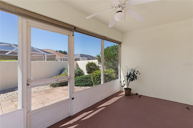 1116 San Bernardo Rd, The Villages, FL 32162 - unfurnished sunroom featuring ceiling fan