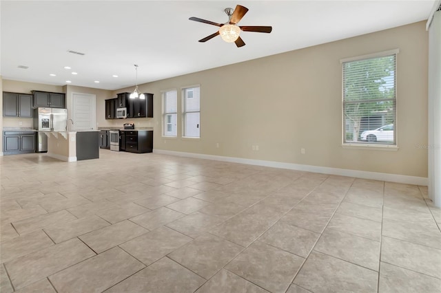 15531 Waterleigh Cove Dr, Winter Garden, FL 34787 - unfurnished living room with ceiling fan, recessed lighting, and light tile patterned flooring