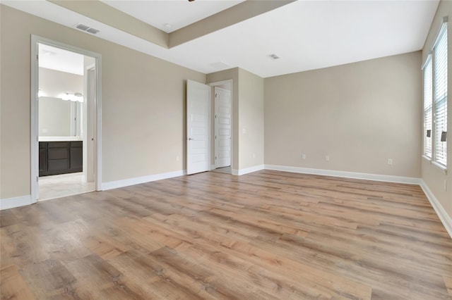 15531 Waterleigh Cove Dr, Winter Garden, FL 34787 - unfurnished bedroom with light wood-type flooring and ensuite bath