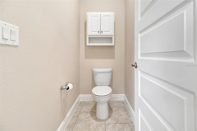 15531 Waterleigh Cove Dr, Winter Garden, FL 34787 - bathroom featuring toilet and tile patterned flooring