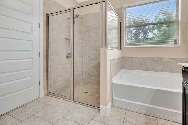 15531 Waterleigh Cove Dr, Winter Garden, FL 34787 - full bath with a shower stall, vanity, a garden tub, and tile patterned floors