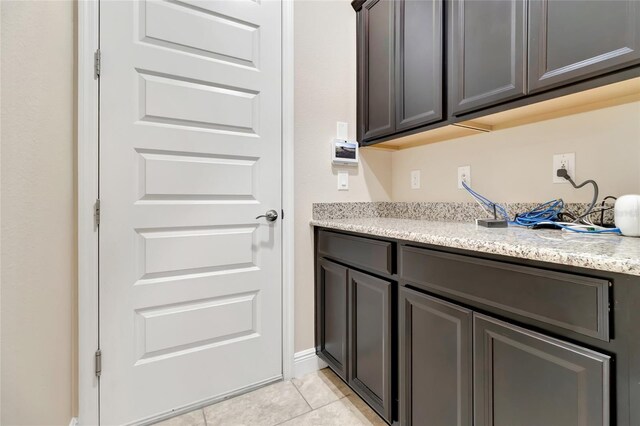 15531 Waterleigh Cove Dr, Winter Garden, FL 34787 - laundry area featuring light tile patterned floors
