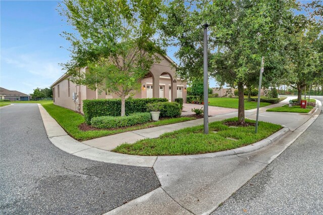 15531 Waterleigh Cove Dr, Winter Garden, FL 34787 - view of property exterior featuring driveway and stucco siding