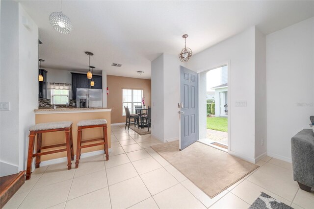 212 Primrose Dr, Davenport, FL 33837 - foyer entrance featuring baseboards and light tile patterned flooring