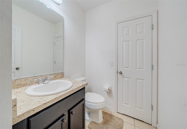 212 Primrose Dr, Davenport, FL 33837 - half bathroom featuring vanity, tile patterned floors, toilet, and baseboards