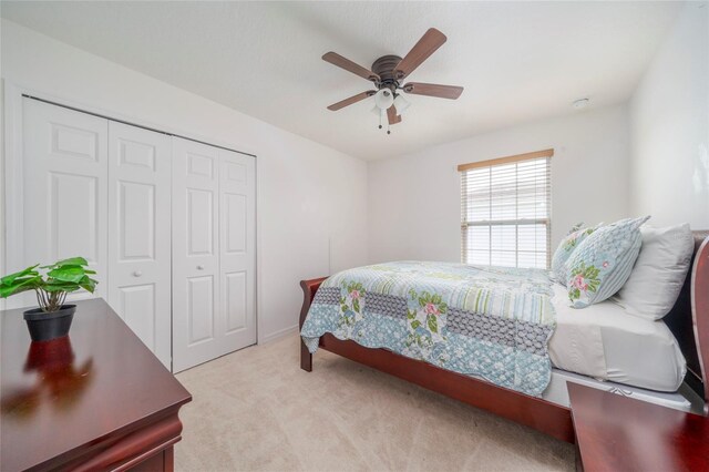 212 Primrose Dr, Davenport, FL 33837 - bedroom with a closet, light carpet, and ceiling fan