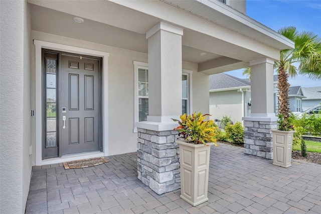 2147 Timber Creek Ln, Clermont, FL 34715 - property entrance featuring stucco siding and a porch
