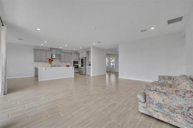 2147 Timber Creek Ln, Clermont, FL 34715 - living room with light wood-style floors, baseboards, and recessed lighting