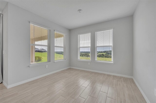 2147 Timber Creek Ln, Clermont, FL 34715 - spare room with light wood-style floors and baseboards