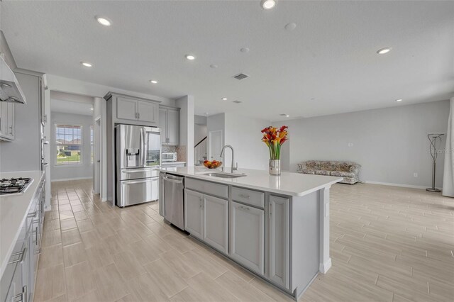 2147 Timber Creek Ln, Clermont, FL 34715 - kitchen featuring appliances with stainless steel finishes, gray cabinets, a sink, baseboards, and recessed lighting