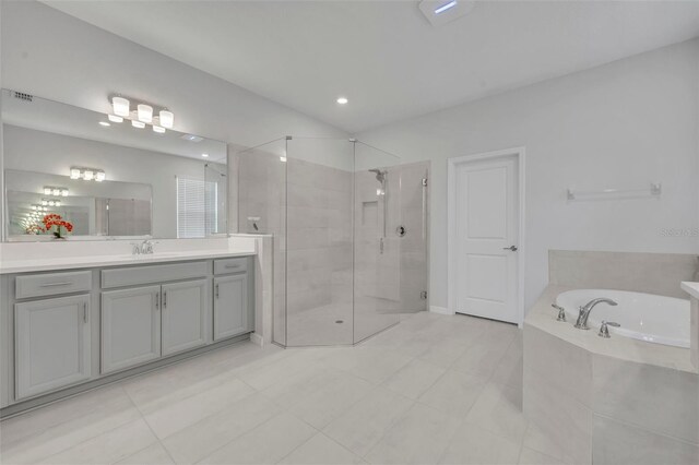 2147 Timber Creek Ln, Clermont, FL 34715 - bathroom featuring vanity, a garden tub, a stall shower, and tile patterned flooring