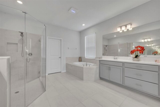 2147 Timber Creek Ln, Clermont, FL 34715 - full bath with vanity, a stall shower, a garden tub, tile patterned flooring, and recessed lighting