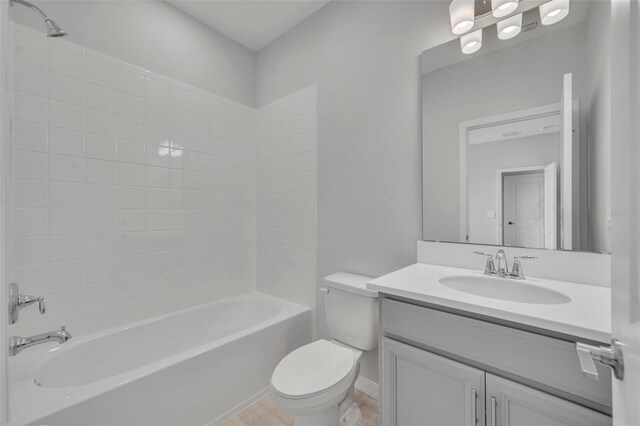 2147 Timber Creek Ln, Clermont, FL 34715 - bathroom featuring toilet, vanity, and tub / shower combination
