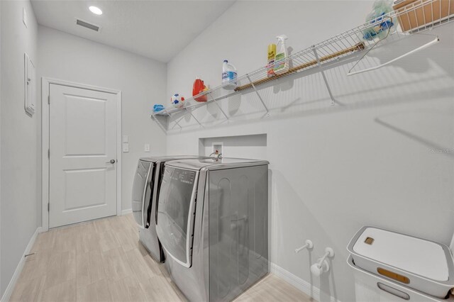 2147 Timber Creek Ln, Clermont, FL 34715 - laundry area featuring washer and dryer, baseboards, and recessed lighting
