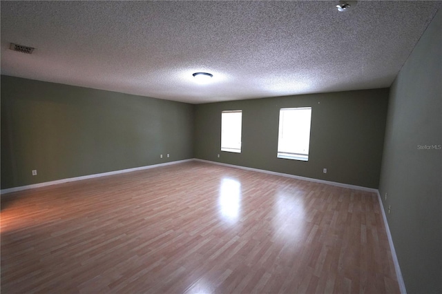 2007 Country Brook Ave, Clermont, FL 34711 - spare room with wood finished floors and a textured ceiling