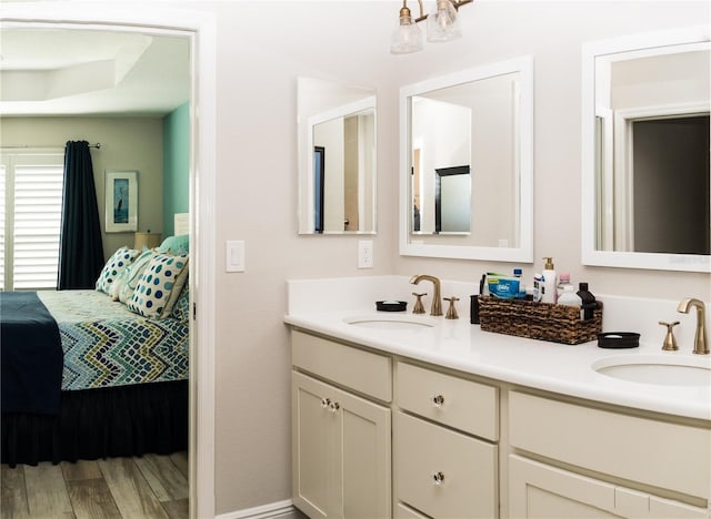 3466 Smedley Rd, The Villages, FL 32163 - ensuite bathroom featuring double vanity and wood finished floors