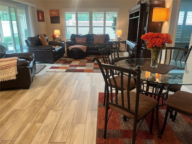 3466 Smedley Rd, The Villages, FL 32163 - dining area featuring light wood-style flooring and healthy amount of natural light