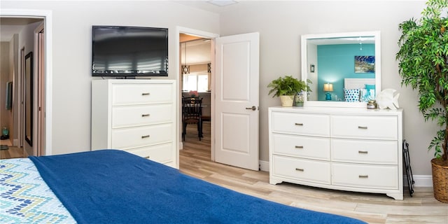 3466 Smedley Rd, The Villages, FL 32163 - bedroom with light wood finished floors and baseboards