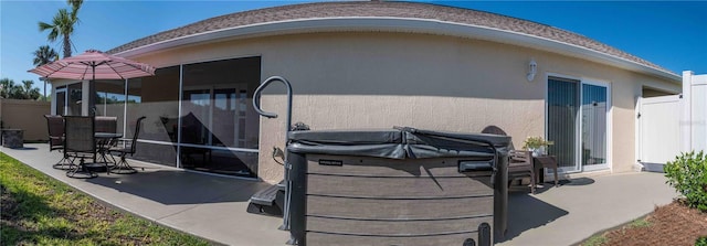 3466 Smedley Rd, The Villages, FL 32163 - back of house with a patio area, stucco siding, and a sunroom