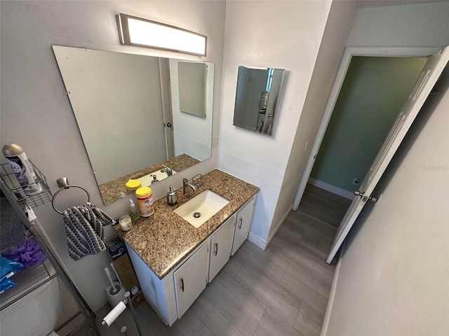 5454-5456 8th Ave, Fort Myers, FL 33907 - bathroom featuring vanity, baseboards, and toilet