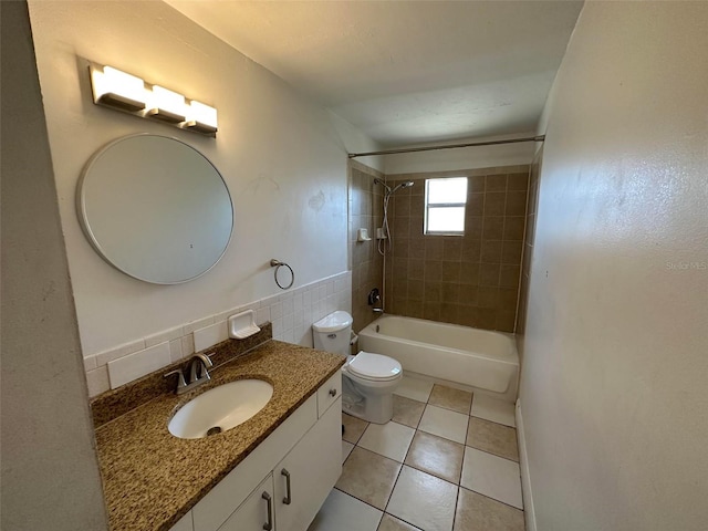 5454-5456 8th Ave, Fort Myers, FL 33907 - bathroom featuring vanity, bathing tub / shower combination, toilet, tile patterned flooring, and tile walls