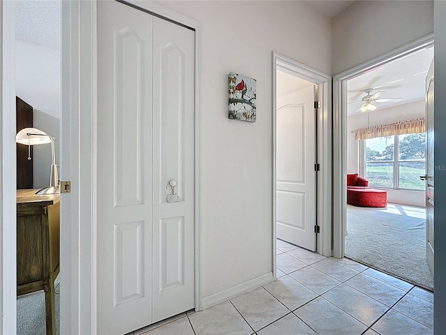 3907 Allamanda Ct, Clermont, FL 34711 - hall with light carpet and light tile patterned flooring