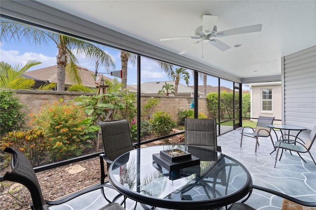 3978 Nottingham Loop, The Villages, FL 32163 - sunroom with outdoor dining area, a ceiling fan, and healthy amount of natural light