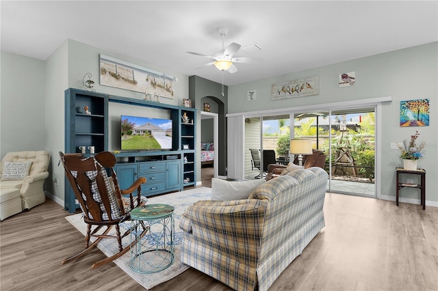 3978 Nottingham Loop, The Villages, FL 32163 - living area featuring light wood finished floors, a ceiling fan, and baseboards
