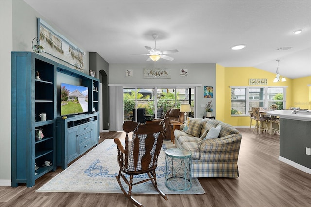 3978 Nottingham Loop, The Villages, FL 32163 - living area featuring wood finished floors, ceiling fan, baseboards, lofted ceiling, and recessed lighting