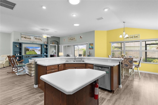 3978 Nottingham Loop, The Villages, FL 32163 - kitchen with dishwasher, a large island, a sink, light countertops, and vaulted ceiling