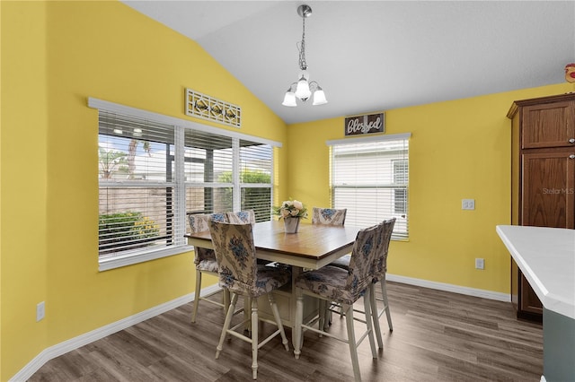 3978 Nottingham Loop, The Villages, FL 32163 - dining area featuring a chandelier, lofted ceiling, dark wood-type flooring, and baseboards