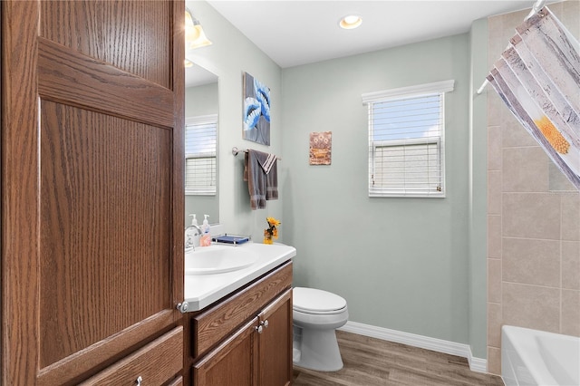 3978 Nottingham Loop, The Villages, FL 32163 - bathroom with vanity, plenty of natural light, baseboards, toilet, and recessed lighting