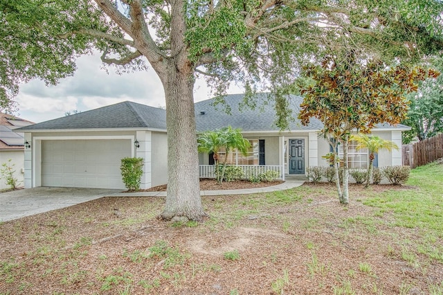 832 Willow Run St, Minneola, FL 34715 - ranch-style house featuring stucco siding, an attached garage, a shingled roof, and driveway