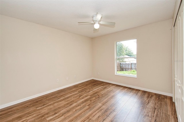 832 Willow Run St, Minneola, FL 34715 - empty room with wood finished floors and a ceiling fan
