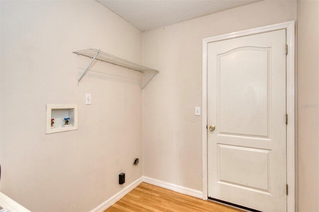 832 Willow Run St, Minneola, FL 34715 - laundry area featuring hookup for a washing machine and light wood-style floors