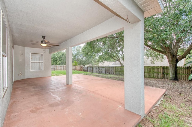 832 Willow Run St, Minneola, FL 34715 - fenced backyard featuring ceiling fan and a patio area
