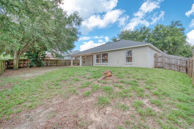 832 Willow Run St, Minneola, FL 34715 - rear view of property with stucco siding, ceiling fan, and a fenced backyard