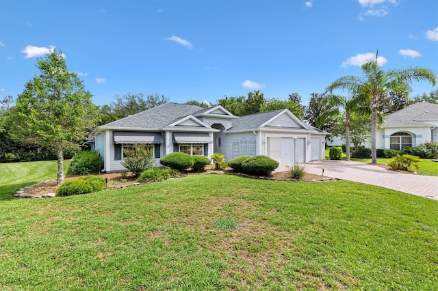 2991 Saint Thomas Ln, The Villages, FL 32162 - ranch-style home featuring driveway, an attached garage, and a front lawn