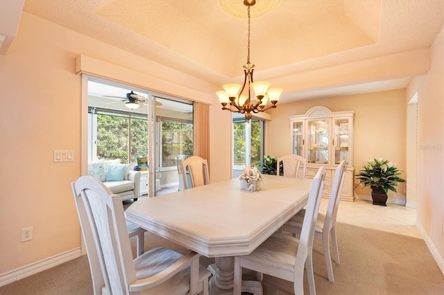 2991 Saint Thomas Ln, The Villages, FL 32162 - dining space with a chandelier, light colored carpet, and baseboards