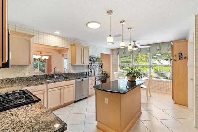 2991 Saint Thomas Ln, The Villages, FL 32162 - kitchen with stainless steel dishwasher, a sink, light brown cabinetry, a chandelier, and a textured ceiling