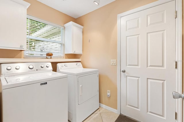 2991 Saint Thomas Ln, The Villages, FL 32162 - washroom with independent washer and dryer, cabinet space, light tile patterned floors, and baseboards
