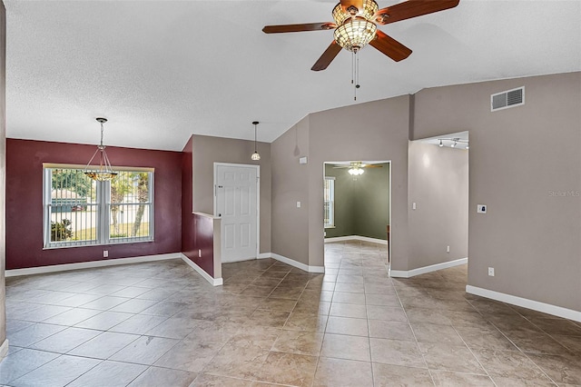 15916 Indian Wells Ct, Clermont, FL 34711 - unfurnished room featuring ceiling fan, vaulted ceiling, light tile patterned floors, baseboards, and a textured ceiling