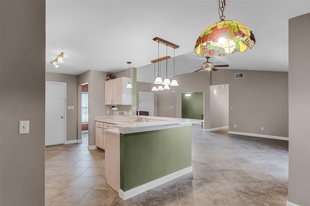 15916 Indian Wells Ct, Clermont, FL 34711 - kitchen with ceiling fan, white cabinetry, light countertops, vaulted ceiling, and decorative light fixtures