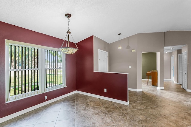 15916 Indian Wells Ct, Clermont, FL 34711 - empty room with vaulted ceiling, baseboards, and tile patterned flooring