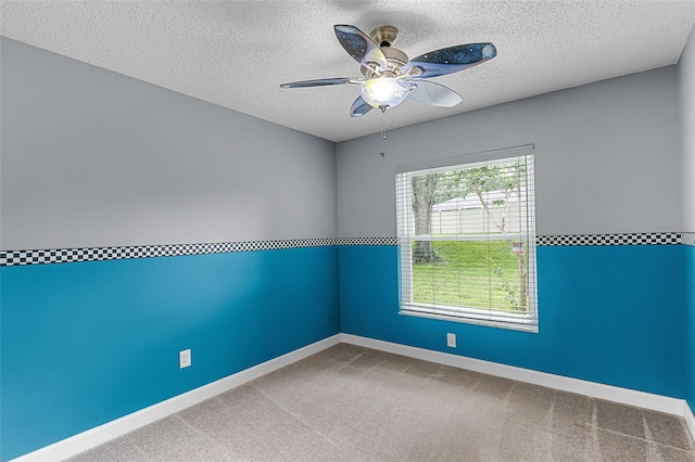 15916 Indian Wells Ct, Clermont, FL 34711 - empty room featuring a textured ceiling, a ceiling fan, baseboards, and carpet flooring