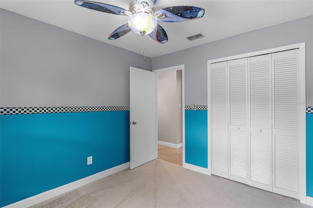 15916 Indian Wells Ct, Clermont, FL 34711 - unfurnished bedroom with carpet floors, baseboards, ceiling fan, and a closet